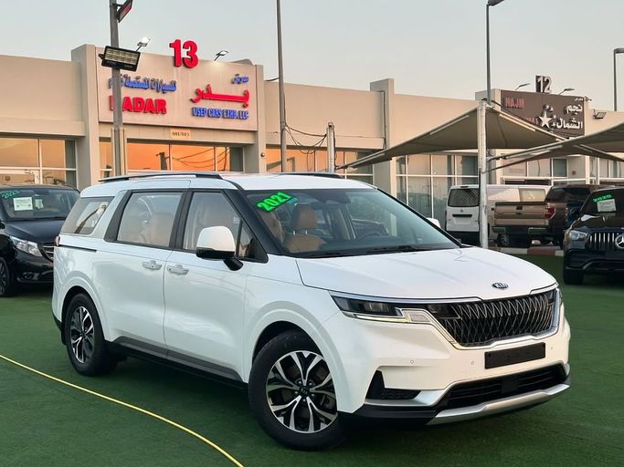 Подержанный Kia Carnival IV, 3.5 л, 2021 в Шардже от Badar Used Cars Белый цвет.  | AUTO.AE
