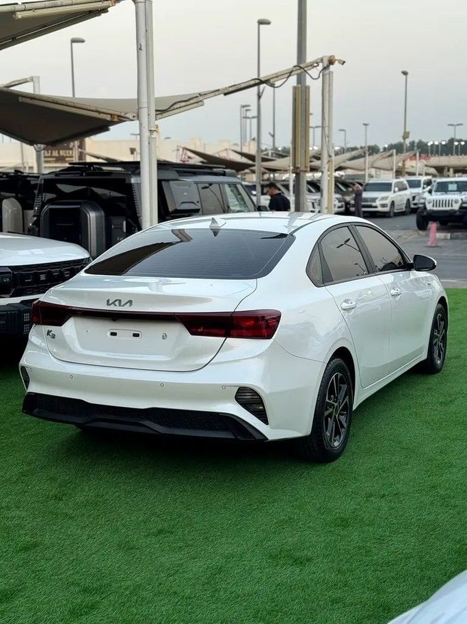 Used Kia K3 II Facelift, 1.6 l, 2023 in Sharjah by Almasar Used Cars, White color. Korean Specs | AUTO.AE