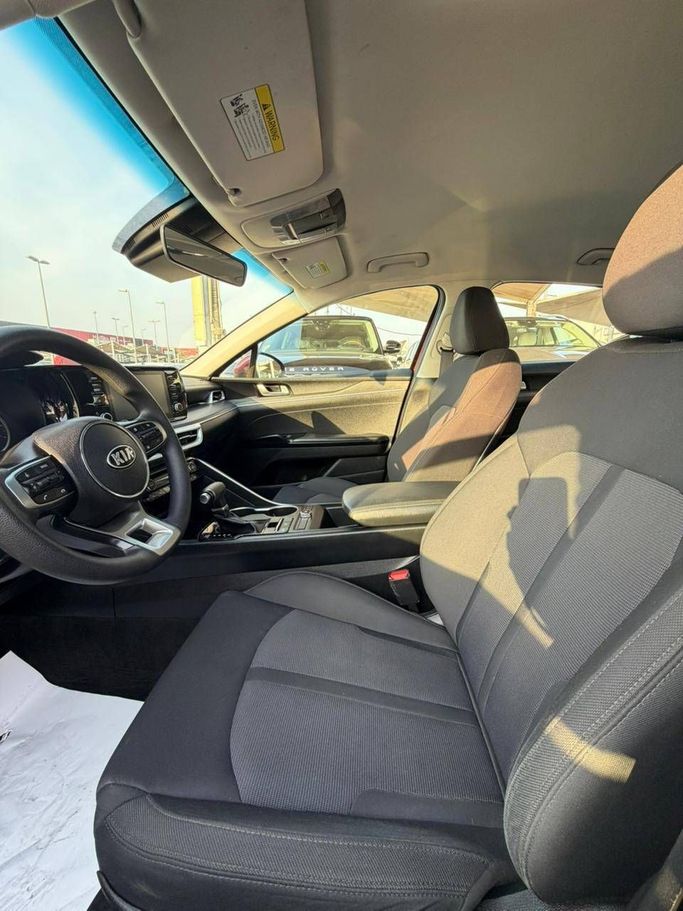 Used Kia K5 III, 1.6 l, 2021 in Sharjah by Al Masah Al Malakia, Red color. American Specs | AUTO.AE