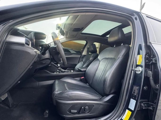 Подержанный Kia K5 III, 2.0 л, 2021 в Шардже от Noor Al Seyoh Used Cars Синий цвет. GCC | AUTO.AE