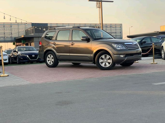 Подержанный Kia Mohave I, 3.8 л, 2014 в Шардже от Al Najem Used Cars Коричневый цвет. GCC | AUTO.AE