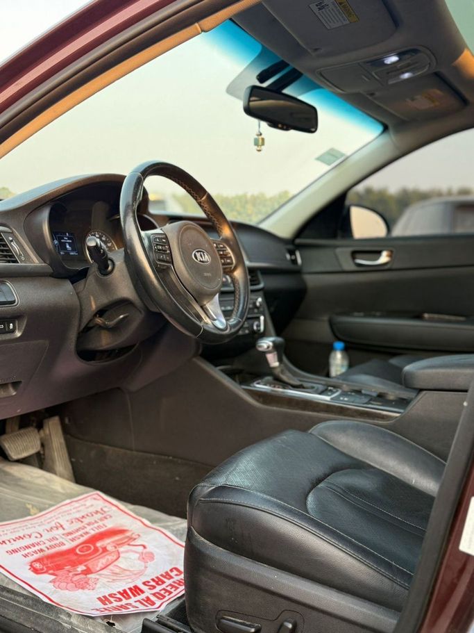 Used Kia Optima IV, 2.4 l, 2017 in Sharjah by Najmat Almajarah Motors, Maroon color. American Specs | AUTO.AE