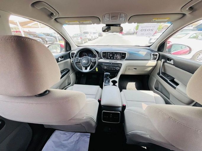 Подержанный Kia Sportage IV Рестайлинг, 2.4 л, 2020 в Шардже от Tabarak Used Cars Красный цвет. Американская | AUTO.AE