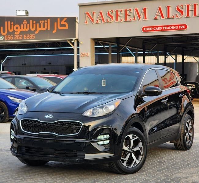 Used Kia Sportage IV Facelift, 2.4 l, 2021 in Sharjah by Nassem Al Sham Used Cars, Black color. American Specs | AUTO.AE