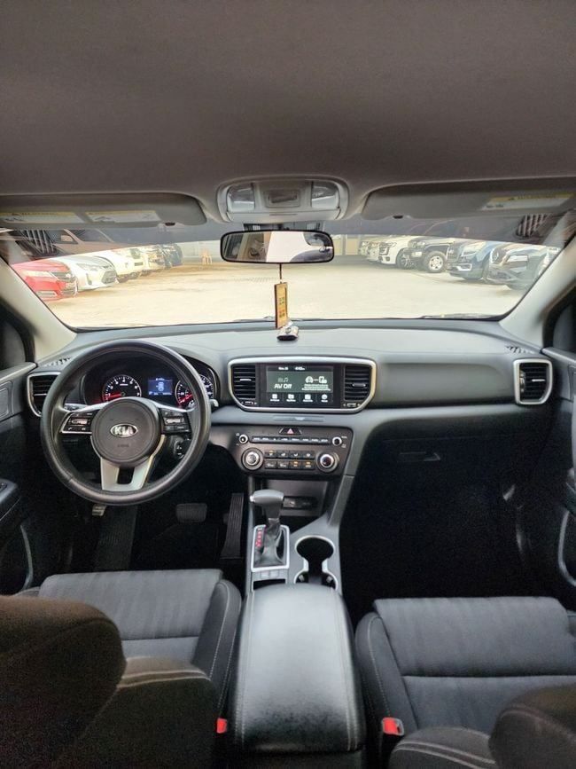 Used Kia Sportage IV Facelift, 2.4 l, 2021 in Sharjah by Nassem Al Sham Used Cars, Black color. American Specs | AUTO.AE