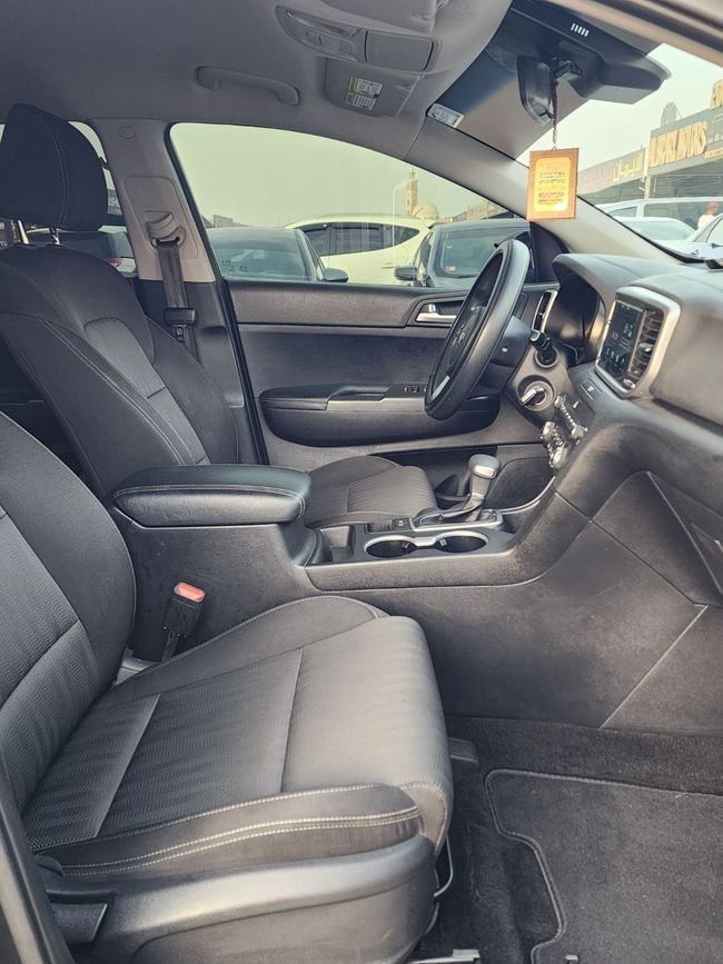 Used Kia Sportage IV Facelift, 2.4 l, 2021 in Sharjah by Nassem Al Sham Used Cars, Black color. American Specs | AUTO.AE