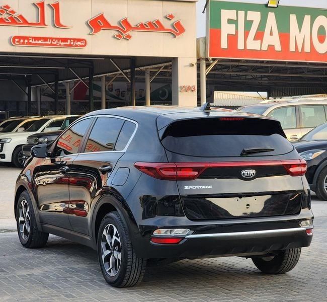 Used Kia Sportage IV Facelift, 2.4 l, 2021 in Sharjah by Nassem Al Sham Used Cars, Black color. American Specs | AUTO.AE