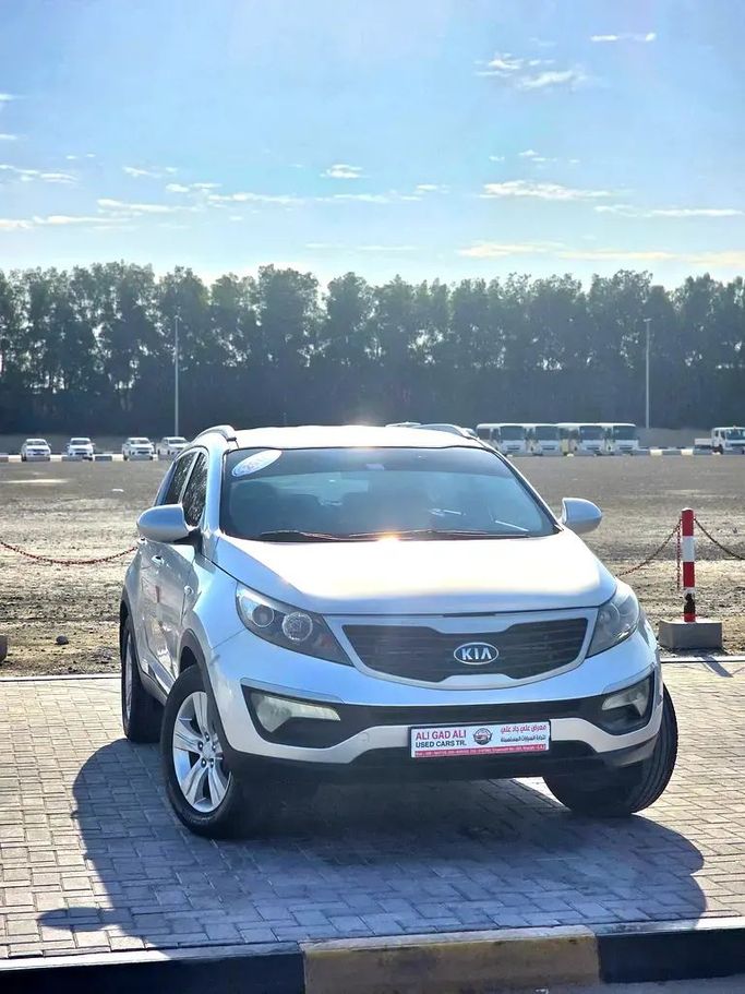 Подержанный Kia Sportage III Рестайлинг, 2.0 л, 2014 в Шардже от Ali Gad Ali Used Cars Серебристый цвет. GCC | AUTO.AE