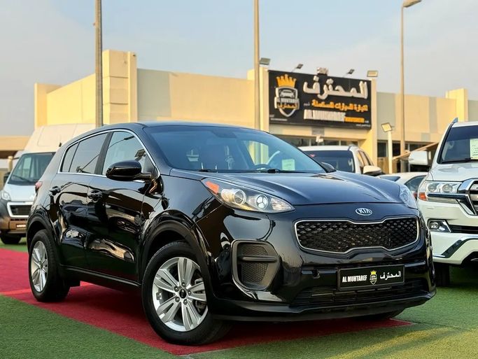 Used Kia Sportage IV, 1.6 l, 2018 in UAE, Sharjah by Al Muhtaref Used Cars, Black color. American Specs | AUTO.AE | Listing #272360