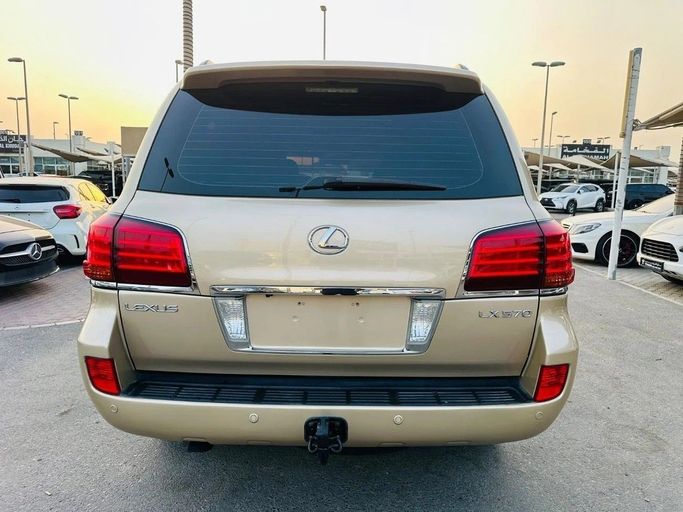 Used Lexus LX 570 III, 5.7 l, 2010 in Sharjah by Titanium Used Cars, Golden color. GCC Specs | AUTO.AE