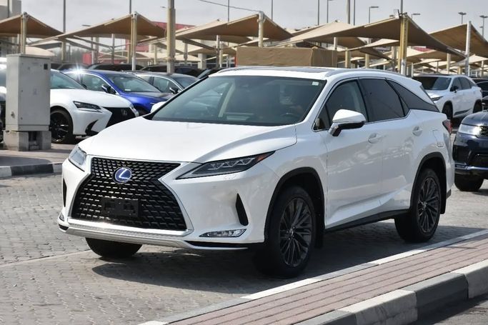 Подержанный Lexus RX 450hL IV Рестайлинг, 3.5 л, 2021 в Шардже от Alfaris Used Cars Белый цвет. Other | AUTO.AE
