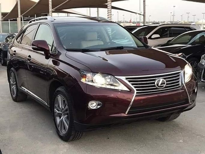 Used Lexus RX 350 IV, 3.5 l, 2015 in Sharjah by Al Nukhba Al Malakyah Used Cars, Burgundy color. American Specs | AUTO.AE