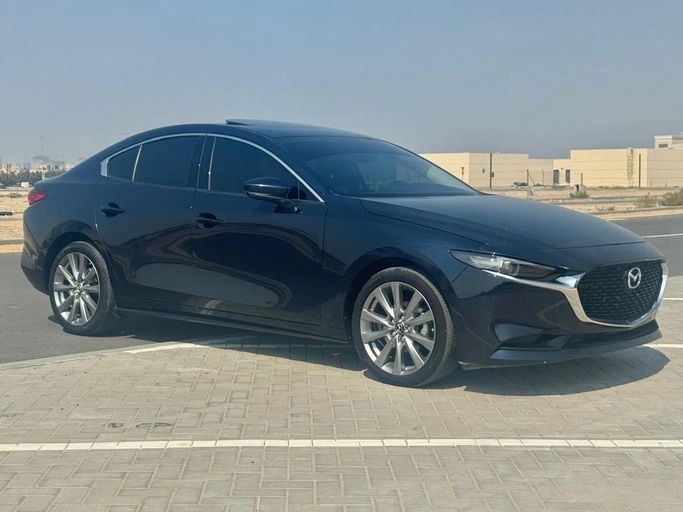 Подержанный Mazda 3 IV (BP), 2.0 л, 2024 в Шардже от Noor Al Seyoh Used Cars Синий цвет. GCC | AUTO.AE
