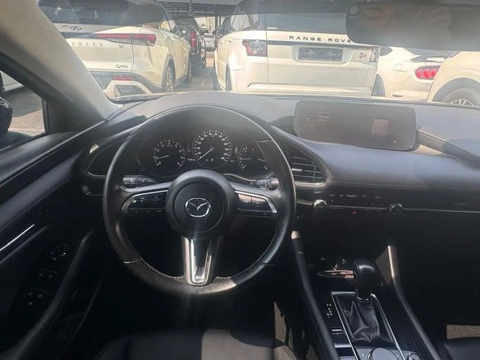 Подержанный Mazda 3 IV (BP), 2.0 л, 2024 в Шардже от Noor Al Seyoh Used Cars Синий цвет. GCC | AUTO.AE