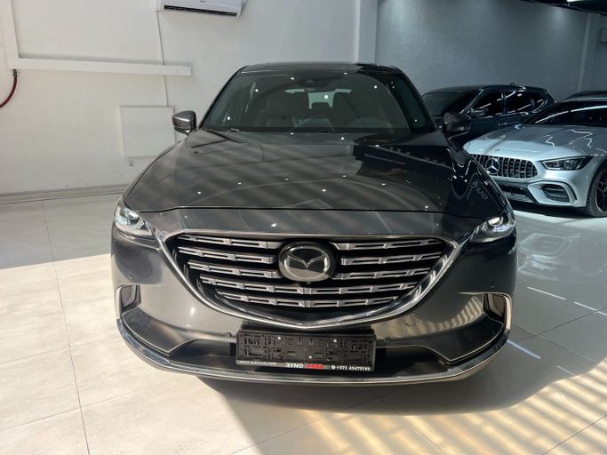 Подержанный Mazda CX-9 II Рестайлинг, 2.5 л, 2021 в Шардже от Ryno Cars Серый цвет. GCC | AUTO.AE