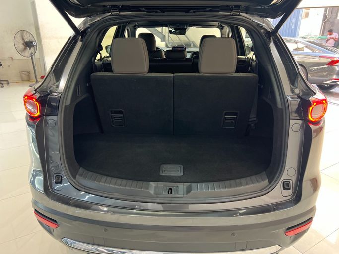 Подержанный Mazda CX-9 II Рестайлинг, 2.5 л, 2021 в Шардже от Ryno Cars Серый цвет. GCC | AUTO.AE