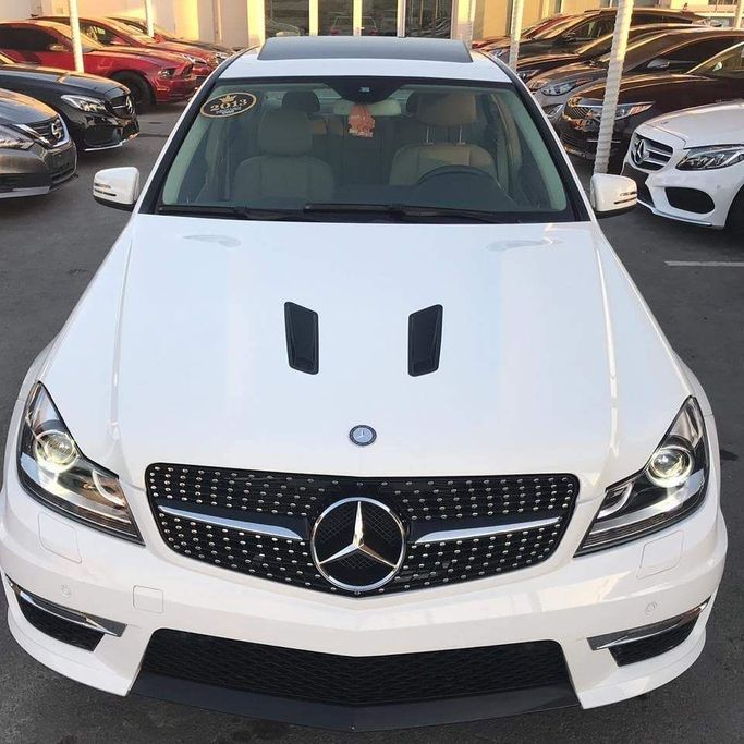 Used Mercedes-Benz C-Class AMG 63 AMG III (W204) Facelift, 6.2 l, 2014 in Sharjah by Al Nukhba Al Malakyah Used Cars, White color. American Specs | AUTO.AE