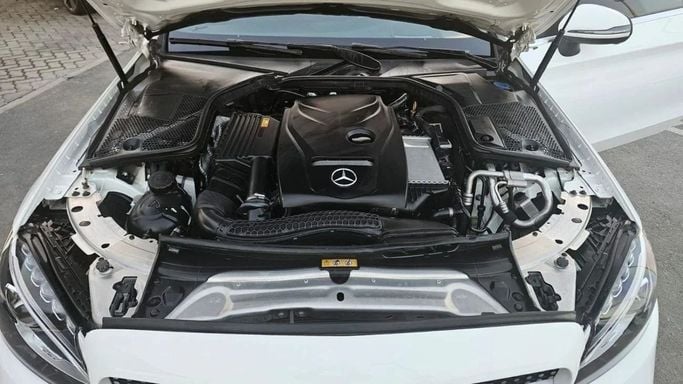 Used Mercedes-Benz C-Class 200 IV (W205) Facelift, 2.0 l, 2018 in Sharjah by Nour Alnukhba Motors, White color. Korean Specs | AUTO.AE