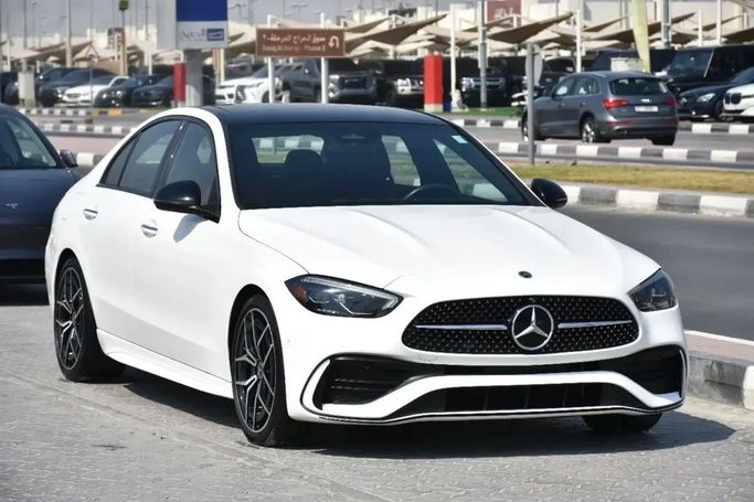 Used Mercedes-Benz C-Class 300 V (W206), 2.0 l, 2022 in Sharjah by Alfaris Used Cars, White color.  | AUTO.AE
