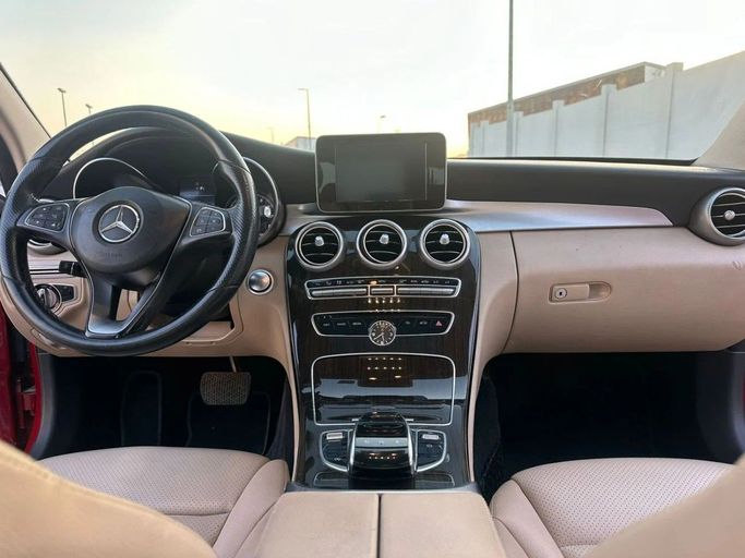 Used Mercedes-Benz C-Class 300 IV (W205), 2.0 l, 2016 in Sharjah by Laqtah Used Cars, Red color. American Specs | AUTO.AE