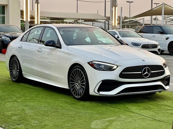 Used Mercedes-Benz C-Class 300 V (W206), 2.0 l, 2022 in Sharjah by Ali Abood Used Cars, White color. American Specs | AUTO.AE