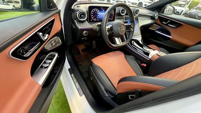 Used Mercedes-Benz C-Class 300 V (W206), 2.0 l, 2022 in Sharjah by Ali Abood Used Cars, White color. American Specs | AUTO.AE