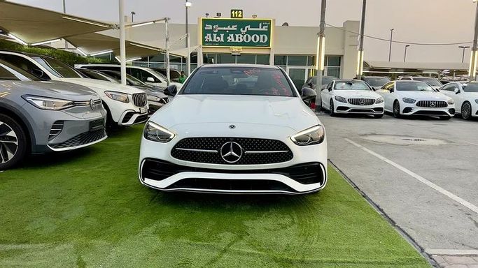 Used Mercedes-Benz C-Class 300 V (W206), 2.0 l, 2022 in Sharjah by Ali Abood Used Cars, White color. American Specs | AUTO.AE