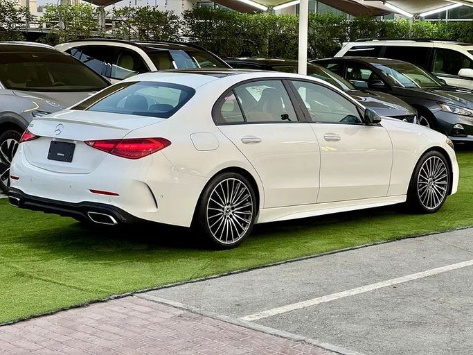 Used Mercedes-Benz C-Class 300 V (W206), 2.0 l, 2022 in Sharjah by Ali Abood Used Cars, White color. American Specs | AUTO.AE