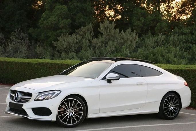 Used Mercedes-Benz C-Class 300 IV (W205), 2.0 l, 2018 in Sharjah by Noor Al Seyoh Used Cars, White color. GCC Specs | AUTO.AE