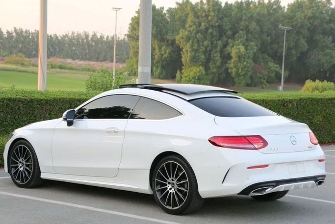Used Mercedes-Benz C-Class 300 IV (W205), 2.0 l, 2018 in Sharjah by Noor Al Seyoh Used Cars, White color. GCC Specs | AUTO.AE
