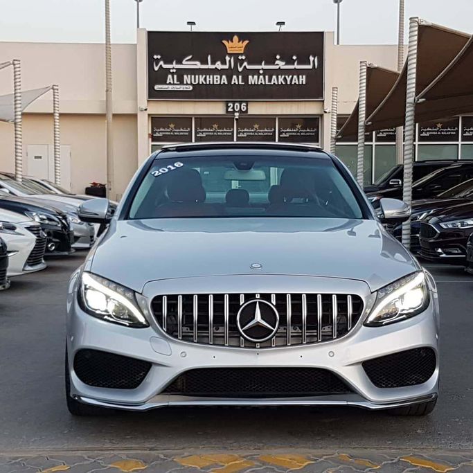 Used Mercedes-Benz C-Class 300 IV (W205), 2.0 l, 2015 in Sharjah by Al Nukhba Al Malakyah Used Cars, Silver color. American Specs | AUTO.AE