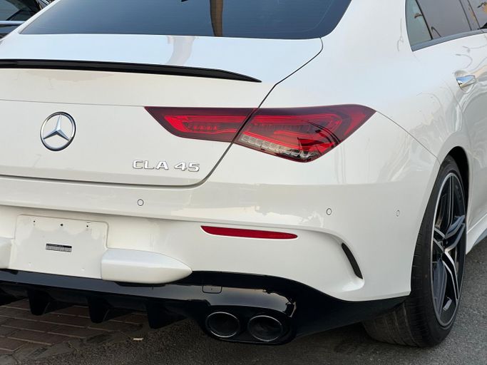 Used Mercedes-Benz CLA AMG 45 AMG II (C118, X118), 2.0 l, 2021 in Sharjah by Ali Used Cars, White color. American Specs | AUTO.AE