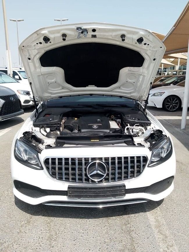 Used Mercedes-Benz E-Class 300 V (W213, S213, C238), 2.0 l, 2018 in Sharjah by Alnawras Cars, White color. Korean Specs | AUTO.AE