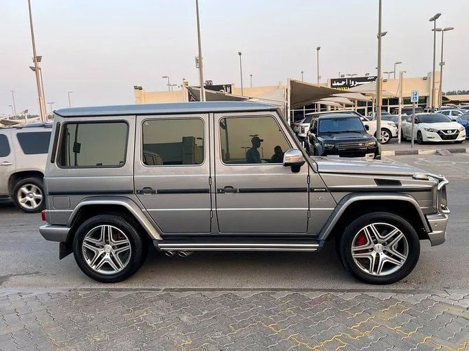 Подержанный Mercedes-Benz G-Class AMG 63 AMG I (W463) Рестайлинг 3, 5.5 л, 2015 в Шардже от Taj Al Impratoor Used Cars Серый цвет. GCC | AUTO.AE