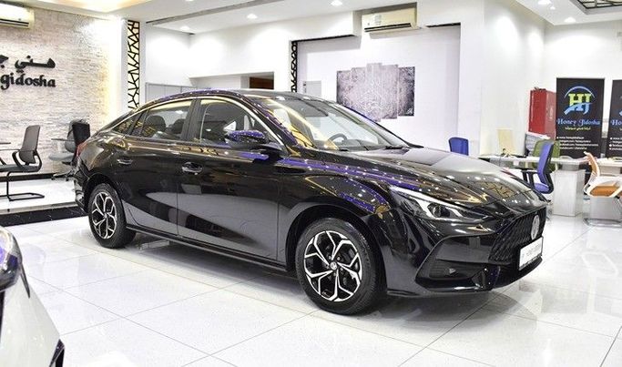 Новый MG 5 II, 1.5 л, 2025 в Шардже от Honey Gidosha Used Cars Tr. Черный цвет.  | AUTO.AE
