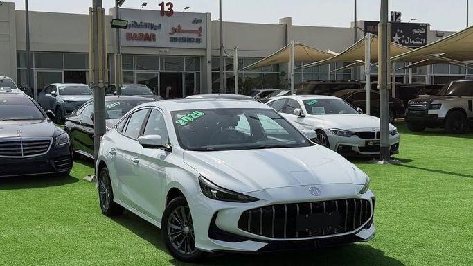 New MG 5 II Facelift, 1.5 l, 2025 in Sharjah by Badar Used Cars, White color.  | AUTO.AE