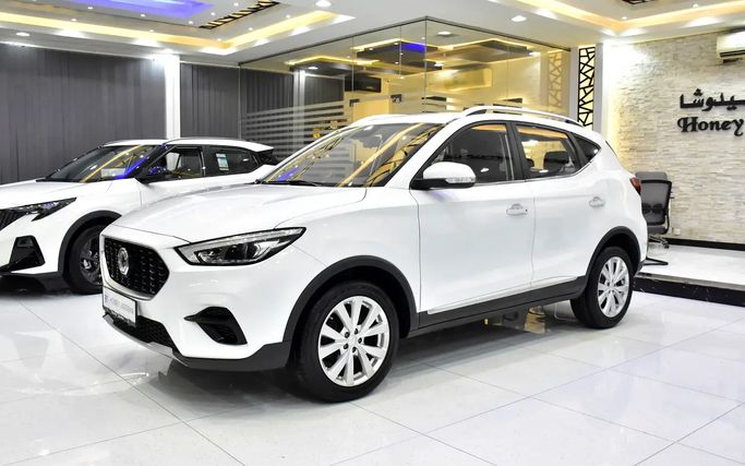 Подержанный MG ZS II Рестайлинг, 1.0 л, 2023 в Шардже от Honey Jidosha Used Cars Tr. Белый цвет. GCC | AUTO.AE | Объявление #273445