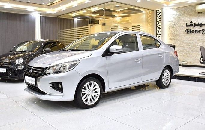 Подержанный Mitsubishi Attrage I Рестайлинг, 1.2 л, 2021 в Шардже от Honey Gidosha Used Cars Tr. Серебристый цвет.  | AUTO.AE