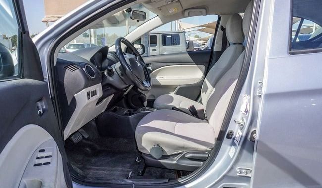 Подержанный Mitsubishi Attrage I, 1.2 л, 2019 в Шардже от Alnujoom Al Malakiah Used Cars Серебристый цвет. GCC | AUTO.AE