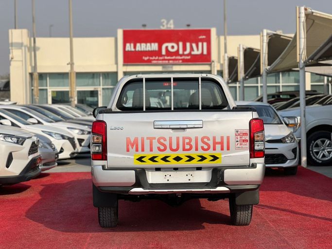 Подержанный Mitsubishi L200 V Рестайлинг, 2.4 л, 2020 в Шардже от Al Aram Cars Белый цвет. GCC | AUTO.AE