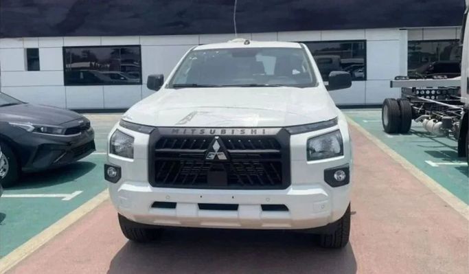 New Mitsubishi L200 VI, 2.4 l, 2023 in Sharjah by Nour Alnukhba Motors, White color. GCC Specs | AUTO.AE