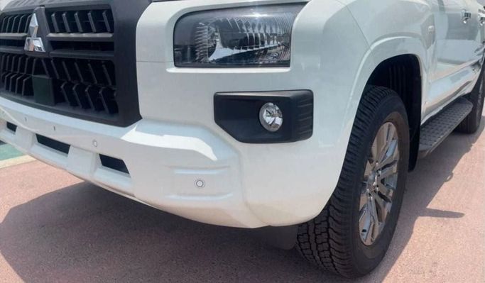 New Mitsubishi L200 VI, 2.4 l, 2023 in Sharjah by Nour Alnukhba Motors, White color. GCC Specs | AUTO.AE