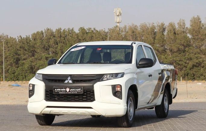 Подержанный Mitsubishi L200 V Рестайлинг, 2.4 л, 2022 в Шардже от Al Sayed Khamis Used Auto Trading Белый цвет. GCC | AUTO.AE