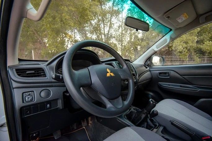 Used Mitsubishi L200 V Facelift, 2.4 l, 2020 in Sharjah by First Choice Cars, White color. GCC Specs | AUTO.AE