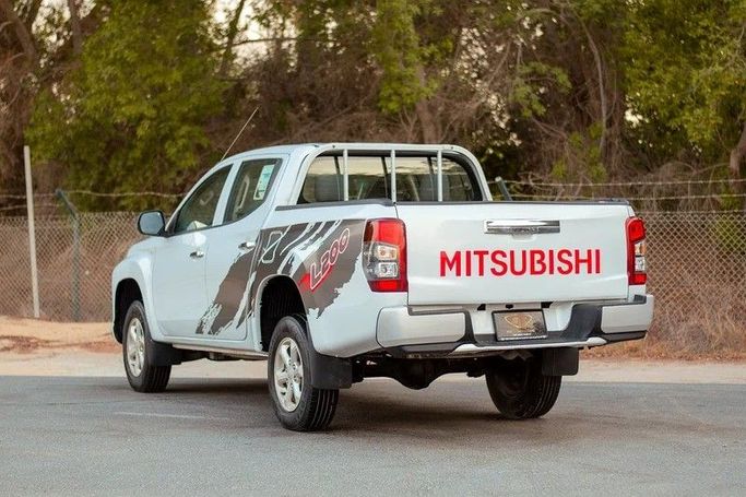 Used Mitsubishi L200 V Facelift, 2.4 l, 2020 in Sharjah by First Choice Cars, White color. GCC Specs | AUTO.AE