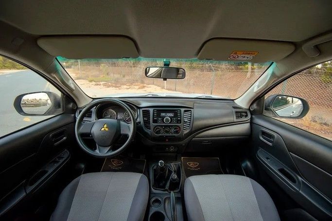 Used Mitsubishi L200 V Facelift, 2.4 l, 2020 in Sharjah by First Choice Cars, White color. GCC Specs | AUTO.AE