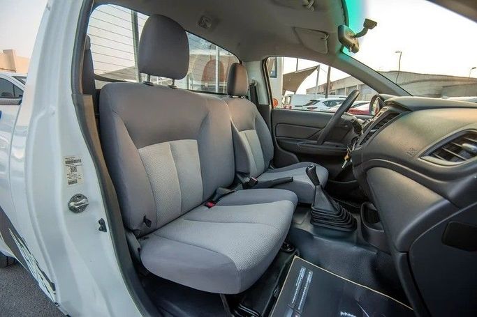 Used Mitsubishi L200 V Facelift, 2.4 l, 2021 in Sharjah by First Choice Cars, White color. GCC Specs | AUTO.AE