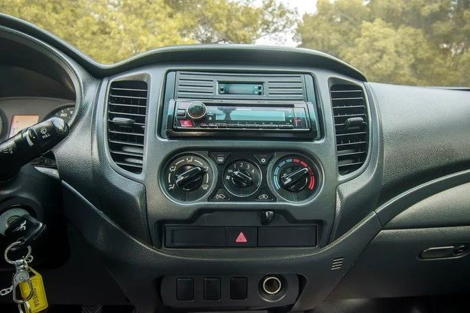 Used Mitsubishi L200 V Facelift, 2.4 l, 2021 in Sharjah by First Choice Cars, White color. GCC Specs | AUTO.AE