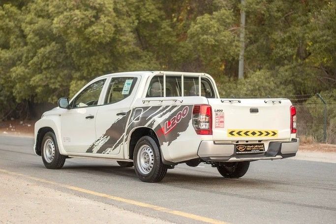 Used Mitsubishi L200 V Facelift, 2.4 l, 2021 in Sharjah by First Choice Cars, White color. GCC Specs | AUTO.AE