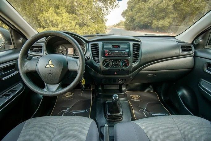 Used Mitsubishi L200 V Facelift, 2.4 l, 2021 in Sharjah by First Choice Cars, White color. GCC Specs | AUTO.AE